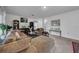 Living room with sectional sofa and built-in shelving at 5557 Oro Valley Rd, Auburndale, FL 33823