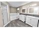 Modern bathroom with double vanity, soaking tub, and shower at 5819 Driftwood Dr, Winter Haven, FL 33884