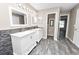 Updated bathroom with double vanity and wood-look floors at 5819 Driftwood Dr, Winter Haven, FL 33884