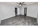 Spacious bedroom with ceiling fan and access to bathroom at 5819 Driftwood Dr, Winter Haven, FL 33884