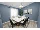 Dining room with a staged table, chairs, and a decorative plant at 5819 Driftwood Dr, Winter Haven, FL 33884