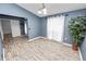 Dining area with wood-look floors and access to the entryway at 5819 Driftwood Dr, Winter Haven, FL 33884