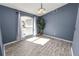 Sunlit dining room featuring wood-look floors and large window at 5819 Driftwood Dr, Winter Haven, FL 33884