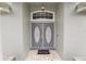 Double front doors with etched glass and a welcoming doormat at 5819 Driftwood Dr, Winter Haven, FL 33884