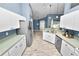 Kitchen with stainless steel appliances and white cabinets at 5819 Driftwood Dr, Winter Haven, FL 33884