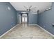 Living room with wood-look floors and ceiling fan at 5819 Driftwood Dr, Winter Haven, FL 33884