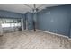 Living area with wood-look floors and sliding glass doors at 5819 Driftwood Dr, Winter Haven, FL 33884