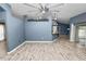 Spacious living room featuring wood-look flooring and a neutral color palette at 5819 Driftwood Dr, Winter Haven, FL 33884