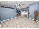 Bright living room with vaulted ceilings and sliding glass doors leading to a patio at 5819 Driftwood Dr, Winter Haven, FL 33884