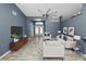 Living room features wood-look floors and double entry doors at 5819 Driftwood Dr, Winter Haven, FL 33884