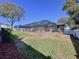 View of backyard with large screened pool area at 5825 High Ridge Loop, Lakeland, FL 33812