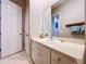 Bright bathroom with vanity and linen storage at 5825 High Ridge Loop, Lakeland, FL 33812