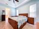 Comfortable bedroom with a king-size bed and wood furniture at 5825 High Ridge Loop, Lakeland, FL 33812