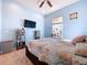 Bedroom with double bed, large closet, and media center at 5825 High Ridge Loop, Lakeland, FL 33812