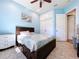 Light blue bedroom with double door closet and dresser at 5825 High Ridge Loop, Lakeland, FL 33812