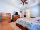 Bright bedroom featuring a large bed and ample storage at 5825 High Ridge Loop, Lakeland, FL 33812