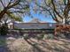 Highlands Ridge community entrance with landscaping and wall at 5825 High Ridge Loop, Lakeland, FL 33812