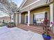 Inviting front porch with double doors and brick steps at 5825 High Ridge Loop, Lakeland, FL 33812