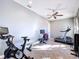 Home gym with various exercise equipment including treadmill and stationary bike at 5825 High Ridge Loop, Lakeland, FL 33812