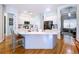 Modern kitchen with white cabinets, large island, and stainless steel appliances at 5825 High Ridge Loop, Lakeland, FL 33812