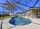 Inviting kidney-shaped pool with a screened enclosure at 5825 High Ridge Loop, Lakeland, FL 33812