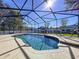 Inviting kidney-shaped pool with a screened enclosure at 5825 High Ridge Loop, Lakeland, FL 33812