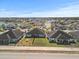 Aerial view of neighborhood with lake at 5876 Great Salt Ct, Lakeland, FL 33805