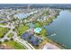 Aerial view of community with lake, pool, tennis courts, and playground at 5876 Great Salt Ct, Lakeland, FL 33805