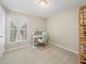 Home office with window, carpet, and a modern desk setup at 5876 Great Salt Ct, Lakeland, FL 33805