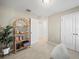 Bedroom with built-in shelving, carpet, and double doors at 5876 Great Salt Ct, Lakeland, FL 33805