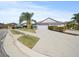 House with gray exterior, two-car garage, and landscaped front yard at 5876 Great Salt Ct, Lakeland, FL 33805