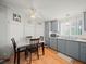 Cozy dining area with wood table and four chairs, adjacent to kitchen at 6087 Southern Oaks Se Dr, Winter Haven, FL 33884