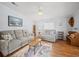 Living room with two sofas and a wooden coffee table at 6087 Southern Oaks Se Dr, Winter Haven, FL 33884