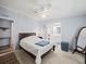 Bright main bedroom with wood bed frame, large windows, and ensuite bath access at 6087 Southern Oaks Se Dr, Winter Haven, FL 33884