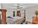 Spacious bedroom with a king-size bed and wood-look floors at 6357 Neamathla Dr, Lakeland, FL 33813