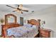 Bedroom with a queen-size bed and stylish wooden furniture at 6357 Neamathla Dr, Lakeland, FL 33813