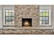 Modern stone fireplace as a focal point at 6357 Neamathla Dr, Lakeland, FL 33813