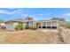 Back exterior view showing the house and patio at 6357 Neamathla Dr, Lakeland, FL 33813