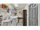 Laundry room with washer, dryer, and storage shelving at 6357 Neamathla Dr, Lakeland, FL 33813