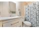 Clean bathroom, featuring a white vanity and shower at 6823 S Lake Henry Ne Dr, Winter Haven, FL 33881