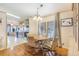 Dining room with wood floors and built-in hutch at 6823 S Lake Henry Ne Dr, Winter Haven, FL 33881