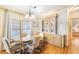 Dining area with wood floors and built-in hutch at 6823 S Lake Henry Ne Dr, Winter Haven, FL 33881