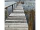 Long wooden dock extending into the lake at 6823 S Lake Henry Ne Dr, Winter Haven, FL 33881