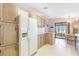 Bright kitchen features wood cabinets, ample counter space, and a view from the window at 6823 S Lake Henry Ne Dr, Winter Haven, FL 33881