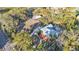 Aerial view of property featuring pool, barn, and mature landscaping at 7030 Klein Rd, Lakeland, FL 33813