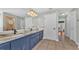 Elegant bathroom with double vanity and a large mirror at 7030 Klein Rd, Lakeland, FL 33813