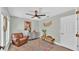 Bedroom with a leather chair, dresser, and a rustic wooden bench at 7030 Klein Rd, Lakeland, FL 33813