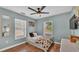 Cozy bedroom with wood floors and a ceiling fan at 7030 Klein Rd, Lakeland, FL 33813