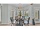 Bright breakfast nook features a round table and views of the backyard at 7030 Klein Rd, Lakeland, FL 33813