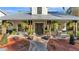 Front porch with hanging ferns, a bench, and a pathway leading to the entrance at 7030 Klein Rd, Lakeland, FL 33813